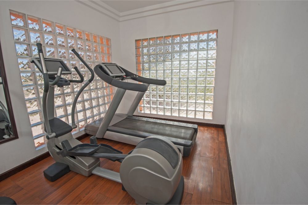 elliptical and treadmill machine in private gym