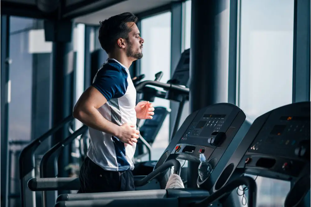 Athletic man running on treadmill
